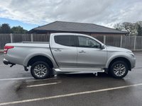 USED 2019 19 MITSUBISHI L200 2.4 DI-D DC Warrior Pickup Double Cab 4dr Diesel Auto 4WD Euro 6 (178 ps) With only one owner and exceptionally low mileage for its age, this 2019 Mitsubishi L200 2.4 DI-D DC Warrior Pickup Double Cab presents a superb opportunity. This Euro 6 compliant, four wheel drive diesel automatic boasts a powerful 2.4 litre engine and a substantial towing weight of 3100 kg, making it a capable workhorse. Its clear vehicle history check provides peace of mind, while notable features include Bi-Xenon HID headlamps, front seat heaters, a rear view camera, automatic light sensors.