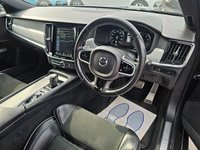 USED 2021 21 VOLVO V90 Grey 2.0 B4 MHEV R-Design, 80,900 miles, ULEZ compliant, Automatic, Sat Nav, Leather, Rear camera, CarPlay/Android Auto, Full Volvo Service history This 2021 Volvo V90 B4 R Design offers a compelling blend of style and efficiency, boasting a 2.0 litre petrol hybrid engine and meeting Euro 6 emission standards.  With a 3 month warranty for your peace of mind, this R Design trim level comes equipped with a Climate Pack featuring heated seats and a heated steering wheel, perfect for those colder days.  Enjoy seamless connectivity with smartphone integration, including Apple CarPlay and Android Auto, and the convenience of Keyless Drive with ke