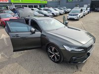 USED 2021 21 VOLVO V90 Grey 2.0 B4 MHEV R-Design, 80,900 miles, ULEZ compliant, Automatic, Sat Nav, Leather, Rear camera, CarPlay/Android Auto, Full Volvo Service history This 2021 Volvo V90 B4 R Design offers a compelling blend of style and efficiency, boasting a 2.0 litre petrol hybrid engine and meeting Euro 6 emission standards.  With a 3 month warranty for your peace of mind, this R Design trim level comes equipped with a Climate Pack featuring heated seats and a heated steering wheel, perfect for those colder days.  Enjoy seamless connectivity with smartphone integration, including Apple CarPlay and Android Auto, and the convenience of Keyless Drive with ke