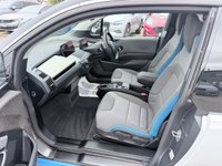 USED 2020 70 BMW I3 White 42.2kWh electric hatchback, 25,450 miles, Automatic, 19in alloys, CarPlay/Android Auto, Sat nav, Rear camera, Heated seats, DAB, A/C. This 2020 BMW i3 presents an exceptional ownership proposition, having been meticulously maintained by a single owner and boasting remarkably low mileage for its age at just 25,450 miles. As a fully electric vehicle, it offers an impressive battery total capacity of 42 kWh, providing a maximum range of 190 miles when new. Charging is convenient, with a full charge at home using a 7kW charger taking approximately 5 hours and 15 minutes, while rapid public charging can replenish the battery from e