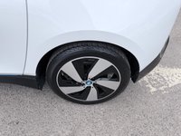 USED 2020 70 BMW I3 White 42.2kWh electric hatchback, 25,450 miles, Automatic, 19in alloys, CarPlay/Android Auto, Sat nav, Rear camera, Heated seats, DAB, A/C. This 2020 BMW i3 presents an exceptional ownership proposition, having been meticulously maintained by a single owner and boasting remarkably low mileage for its age at just 25,450 miles. As a fully electric vehicle, it offers an impressive battery total capacity of 42 kWh, providing a maximum range of 190 miles when new. Charging is convenient, with a full charge at home using a 7kW charger taking approximately 5 hours and 15 minutes, while rapid public charging can replenish the battery from e