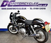 USED 2009 TRIUMPH Thruxton 900 865 Roadster/Retro (69 ps) A cool, low mileage collectable Caf&eacute; Racer here, a great colour scheme on what are becoming a rare sight these days.