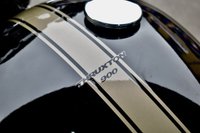 USED 2009 TRIUMPH Thruxton 900 865 Roadster/Retro (69 ps) A cool, low mileage collectable Caf&eacute; Racer here, a great colour scheme on what are becoming a rare sight these days.