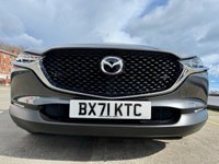 USED 2021 71 MAZDA CX-30 2.0 e-SKYACTIV X MHEV SE-L Lux SUV 5dr Petrol Manual Euro 6 (s/s) (186 ps) Huge value for this 71 reg fabulous example in dark steel grey metallic with Sat Nav , Reversing Camera , 6 Speed, Air Conditioning, Auto Climate Control, Automatic Lights, Cruise Control, Dual Zone Climate, Heated Seats ,alloys wheels -1 previous owner in immac condition -stylish looks and so good to drive with the backing of Mazda legendary quality and reliability -great buy -comes with MBI/ Warranty which can be extended and upgraded to 24 months , Feb 2027  MOT , Oil and Filter /PDI Service