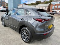 USED 2021 71 MAZDA CX-30 2.0 e-SKYACTIV X MHEV SE-L Lux SUV 5dr Petrol Manual Euro 6 (s/s) (186 ps) Huge value for this 71 reg fabulous example in dark steel grey metallic with Sat Nav , Reversing Camera , 6 Speed, Air Conditioning, Auto Climate Control, Automatic Lights, Cruise Control, Dual Zone Climate, Heated Seats ,alloys wheels -1 previous owner in immac condition -stylish looks and so good to drive with the backing of Mazda legendary quality and reliability -great buy -comes with MBI/ Warranty which can be extended and upgraded to 24 months , Feb 2027  MOT , Oil and Filter /PDI Service