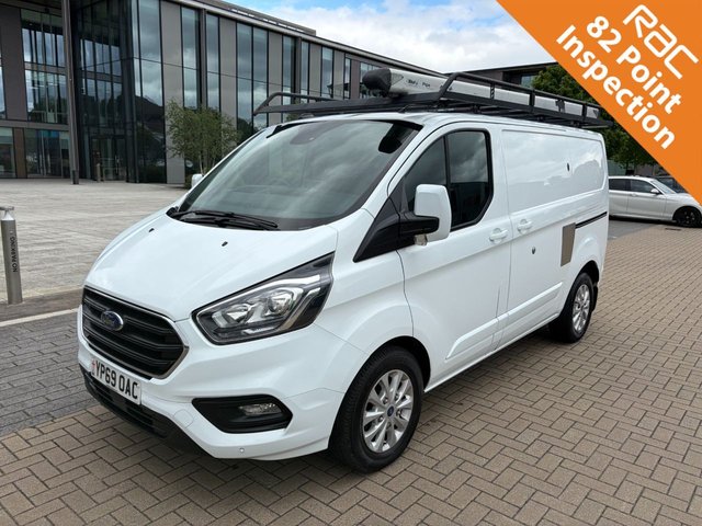 View our Ford Transit Custom 280 LIMITED 2.0EcoBlue EU6 S/S L1 H1 130ps *A/C*ALLOYS*SENSORS*FULL RHINO ROOF RACK*SECURITY LOCKS*HEAT PACK*EL PACK*