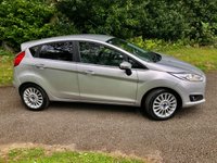 USED 2014 64 FORD FIESTA 1.0T EcoBoost Titanium Hatchback 5dr Petrol Manual Euro 5 (s/s) (100 ps) 1 FAMILY OWNED WITH ONLY 54,600 MILES//20 POUND ROAD TAX A YEAR//GREAT SERVICE HISTORY -FULL WET BELT REPLACEMENT-UPPER AND LOWER+ WATER PUMP JUST RENEWED BY US//BLUETOOTH//DAB,,ELECTRIC FOLDING MIRRORS//ALLOYS//AIRCON//REAR PARKING SENSORS//FULL SIZE SPARE WHEEL//FRONT FOG LIGHTS//GREAT SERVICE HISTORY X9 SERVICE STAMPS AND FULLY DOCUMENTED WITH INVOICES///NEW MOT JUST CARRIED OUT (100 ps) 1 FAMILY OWNED WITH ONLY 54,600 MILES//20 POUND ROAD TAX A YEAR//GREAT SERVICE HISTORY -FULL WET BELT REPLACEMENT-UPPER AND LOWER+ WATER PUMP JUST RENEWED BY US//BLUETOOTH//DAB,,ELECTRIC FOLDING MIRRORS//ALLOYS//AIRCON//REAR PARKING SENSORS//FULL SIZE SPARE WHEEL//FRONT FOG LIGHTS//GREAT SERVICE HISTORY X9 SERVICE STAMPS AND FULLY DOCUMENTED WITH INVOICES/////KEYLESS ENTRY AND STARTING
