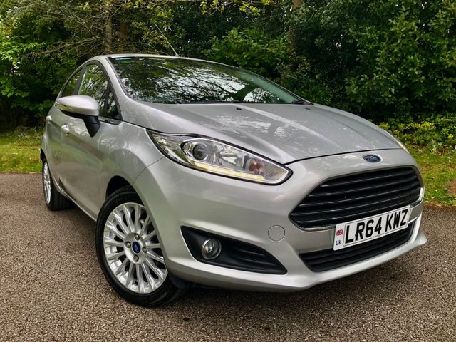 2014 64 Ford Fiesta 1.0T EcoBoost Titanium Hatchback 5dr Petrol Manual Euro 5 (s/s) (100 ps) 1 FAMILY OWNED WITH ONLY 54,600 MILES//20 POUND ROAD TAX A YEAR//GREAT SERVICE HISTORY -FULL WET BELT REPLACEMENT-UPPER AND LOWER+ WATER PUMP JUST RENEWED BY US//BLUETOOTH//DAB,,ELECTRIC FOLDING MIRRORS//ALLOYS//AIRCON//REAR PARKING SENSORS//FULL SIZE SPARE WHEEL//FRONT FOG LIGHTS//GREAT SERVICE HISTORY X9 SERVICE STAMPS AND FULLY DOCUMENTED WITH INVOICES///NEW MOT JUST CARRIED OUT