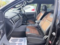 USED 2018 18 FORD RANGER Black 3.2 TDCi Wildtrak pickup, 98,000 miles, Automatic 4WD, 18in Alloys, Sat nav, Rear camera, Touchscreen, A/C. Plus VAT @ 20%! This 2018 Ford Ranger TDCi Wildtrak is ready for its next adventure, benefiting from a 12 month MOT provided on purchase and a 3 month warranty for your peace of mind. and a very goood service History @ 1K, 23K, 34K, 46K, 58K, 73K, and 95K  Under the bonnet, you'll find a robust 3.2L diesel engine paired with a capable four wheel drive system, making it well suited for a variety of tasks and terrains.  Inside, the Wildtrak trim offers comfort and convenience with Dual Zone Electronic Automatic T