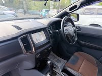 USED 2018 18 FORD RANGER Black 3.2 TDCi Wildtrak pickup, 98,000 miles, Automatic 4WD, 18in Alloys, Sat nav, Rear camera, Touchscreen, A/C. Plus VAT @ 20%! This 2018 Ford Ranger TDCi Wildtrak is ready for its next adventure, benefiting from a 12 month MOT provided on purchase and a 3 month warranty for your peace of mind. and a very goood service History @ 1K, 23K, 34K, 46K, 58K, 73K, and 95K  Under the bonnet, you'll find a robust 3.2L diesel engine paired with a capable four wheel drive system, making it well suited for a variety of tasks and terrains.  Inside, the Wildtrak trim offers comfort and convenience with Dual Zone Electronic Automatic T