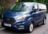 USED 2020 70 FORD TOURNEO CUSTOM 2.0 320 EcoBlue Titanium Minibus 5dr Diesel Auto L1 Euro 6 (s/s) (130 ps).*SIX SEATS+RAMP*AUTO*FORD HISTORY*OVER 70 MINIBUSES IN STOCK* This 2020 Ford Tourneo Custom 2.0 320 EcoBlue Titanium Auto L1 Euro 6 (s/s) 5dr presents a superb ownership proposition, having been meticulously maintained by its single owner and boasting a low mileage of just 49,000 miles for its age.  This 320 Titanium derivative, powered by an efficient 2.0L Euro 6 diesel engine, offers a refined driving experience.  It comes equipped with practical features such as door mirrors with blind spot eliminator and integrated side indicators, including BLIS blind