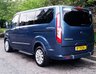 USED 2020 70 FORD TOURNEO CUSTOM 2.0 320 EcoBlue Titanium Minibus 5dr Diesel Auto L1 Euro 6 (s/s) (130 ps).*SIX SEATS+RAMP*AUTO*FORD HISTORY*OVER 70 MINIBUSES IN STOCK* This 2020 Ford Tourneo Custom 2.0 320 EcoBlue Titanium Auto L1 Euro 6 (s/s) 5dr presents a superb ownership proposition, having been meticulously maintained by its single owner and boasting a low mileage of just 49,000 miles for its age.  This 320 Titanium derivative, powered by an efficient 2.0L Euro 6 diesel engine, offers a refined driving experience.  It comes equipped with practical features such as door mirrors with blind spot eliminator and integrated side indicators, including BLIS blind