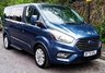 USED 2020 70 FORD TOURNEO CUSTOM 2.0 320 EcoBlue Titanium Minibus 5dr Diesel Auto L1 Euro 6 (s/s) (130 ps).*SIX SEATS+RAMP*AUTO*FORD HISTORY*OVER 70 MINIBUSES IN STOCK* This 2020 Ford Tourneo Custom 2.0 320 EcoBlue Titanium Auto L1 Euro 6 (s/s) 5dr presents a superb ownership proposition, having been meticulously maintained by its single owner and boasting a low mileage of just 49,000 miles for its age.  This 320 Titanium derivative, powered by an efficient 2.0L Euro 6 diesel engine, offers a refined driving experience.  It comes equipped with practical features such as door mirrors with blind spot eliminator and integrated side indicators, including BLIS blind