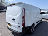 USED 2018 68 FORD TRANSIT CUSTOM White 2.0 300 EcoBlue panel van, 94,000 miles, Euro 6, ULEZ compliant, 6-speed manual, Aftermarket Touchscreen, Reverse Camera, Bluetooth. No VAT! This 2018 Ford Transit Custom offers excellent peace of mind with its MOT valid until December 2026. This 2.0 300 EcoBlue L1 H1 Euro 6 5dr model is equipped with a reliable 2.0L Diesel Engine and meets Euro 6 emissions standards. For your entertainment and connectivity needs, it features an AM-FM Radio with USB and Bluetooth, along with an Emergency Assistance function. The ICE Pack 12 provides a single DIN sized audio unit, also including Bluetooth functionality and a aftermarket touchscreen di