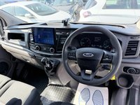 USED 2018 68 FORD TRANSIT CUSTOM White 2.0 300 EcoBlue panel van, 94,000 miles, Euro 6, ULEZ compliant, 6-speed manual, Aftermarket Touchscreen, Reverse Camera, Bluetooth. No VAT! This 2018 Ford Transit Custom offers excellent peace of mind with its MOT valid until December 2026. This 2.0 300 EcoBlue L1 H1 Euro 6 5dr model is equipped with a reliable 2.0L Diesel Engine and meets Euro 6 emissions standards. For your entertainment and connectivity needs, it features an AM-FM Radio with USB and Bluetooth, along with an Emergency Assistance function. The ICE Pack 12 provides a single DIN sized audio unit, also including Bluetooth functionality and a aftermarket touchscreen di