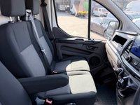 USED 2018 68 FORD TRANSIT CUSTOM White 2.0 300 EcoBlue panel van, 94,000 miles, Euro 6, ULEZ compliant, 6-speed manual, Aftermarket Touchscreen, Reverse Camera, Bluetooth. No VAT! This 2018 Ford Transit Custom offers excellent peace of mind with its MOT valid until December 2026. This 2.0 300 EcoBlue L1 H1 Euro 6 5dr model is equipped with a reliable 2.0L Diesel Engine and meets Euro 6 emissions standards. For your entertainment and connectivity needs, it features an AM-FM Radio with USB and Bluetooth, along with an Emergency Assistance function. The ICE Pack 12 provides a single DIN sized audio unit, also including Bluetooth functionality and a aftermarket touchscreen di