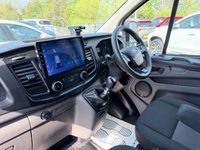 USED 2018 68 FORD TRANSIT CUSTOM White 2.0 300 EcoBlue panel van, 94,000 miles, Euro 6, ULEZ compliant, 6-speed manual, Aftermarket Touchscreen, Reverse Camera, Bluetooth. No VAT! This 2018 Ford Transit Custom offers excellent peace of mind with its MOT valid until December 2026. This 2.0 300 EcoBlue L1 H1 Euro 6 5dr model is equipped with a reliable 2.0L Diesel Engine and meets Euro 6 emissions standards. For your entertainment and connectivity needs, it features an AM-FM Radio with USB and Bluetooth, along with an Emergency Assistance function. The ICE Pack 12 provides a single DIN sized audio unit, also including Bluetooth functionality and a aftermarket touchscreen di