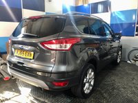 USED 2015 65 FORD KUGA 1.5T EcoBoost Titanium SUV 5dr Petrol Manual 2WD Euro 6 (s/s) (150 ps) A truly stunning example of this Ulez compliant very low mileage Suv fin ished in Magnetic Grey complimented with 18" alloys .This car comes with full dealer service history and comes equipped with front and rear parking sensors with self park facility ,full electric tailgate with release , Dab cd radio with usb inputs ,Bluetooth connectivity ,rapid clear front screen ,dual zone digital climate control ,Ford Sync voice control system ,cruise control and speed limiter ,auto lights and wipers ,pow