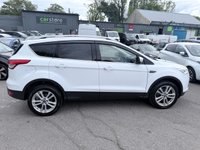 USED 2015 65 FORD KUGA White 1.5T EcoBoost Titanium X SUV, 81,300 miles, Euro 6, ULEZ compliant, Automatic AWD, 8in screen, Sat nav, Panorama roof, 18in alloys, A/C This 2015 Ford Kuga T Titanium X boasts an MOT valid until January 2027, offering excellent peace of mind for the new owner.  This Four Wheel Drive model is powered by an efficient 1.5 litre petrol engine and meets Euro 6 emissions standards.  Inside, you'll find a wealth of features designed for comfort and convenience, including a striking Panorama Roof with a fixed panoramic sunroof, Dual Zone Electronic Automatic Temperature Control for personalised cabin comfort, and Bi-Xenon headlights for