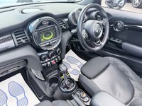 USED 2017 67 MINI CONVERTIBLE 2.0 Cooper S Convertible Automatic, 20,400 miles, 2 owners, full history, Euro 6, Leather interior, Sat Nav, Alloy wheels & great spec throughout. Discover this exceptional 2017 MINI Convertible Cooper S, boasting remarkably low mileage of just 20,400 miles, a testament to its careful ownership by only two previous keepers. This stylish convertible is powered by a responsive 2.0 litre petrol engine, meeting Euro 6 emissions standards. It comes equipped with desirable features including 17 inch Tentacle Spoke alloy wheels in silver, black bonnet stripes for a sporty look, and automatic dual zone air conditioning to ensure comfort for all oc