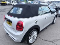 USED 2017 67 MINI CONVERTIBLE 2.0 Cooper S Convertible Automatic, 20,400 miles, 2 owners, full history, Euro 6, Leather interior, Sat Nav, Alloy wheels & great spec throughout. Discover this exceptional 2017 MINI Convertible Cooper S, boasting remarkably low mileage of just 20,400 miles, a testament to its careful ownership by only two previous keepers. This stylish convertible is powered by a responsive 2.0 litre petrol engine, meeting Euro 6 emissions standards. It comes equipped with desirable features including 17 inch Tentacle Spoke alloy wheels in silver, black bonnet stripes for a sporty look, and automatic dual zone air conditioning to ensure comfort for all oc