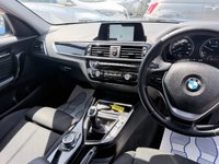 USED 2018 BMW 1 SERIES Blue 1.5 116d Sport hatchback, 83,000 miles, Euro 6, 6-speed manual, 17in alloys, Sat nav, Bluetooth, Air Conditioning, Rear sensors and much more! This 2018 BMW 1 Series 116d Sport is a Euro 6 compliant vehicle, offering an efficient 1.5L diesel engine. This Sport trim model comes equipped with stylish Dark Chrome exhaust tailpipes, enhancing its sporty appearance. For convenience and connectivity, it features Bluetooth hands free with USB audio interface, allowing for seamless music streaming and call handling. Driving in varied conditions is made easier with the rain sensor and automatic headlight activation, ensuring optimal visibility.