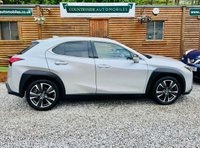 USED 2019 69 LEXUS UX 2.0 250h SUV 5dr Petrol Hybrid E-CVT E-FOUR Euro 6 (s/s) (184 ps) One owner from new with Full Lexus main dealer service history all done at Lexus Bolton. 5 services in total and only 15k miles. Sunroof with rich cream leather. Adaptive cruise control, with reverse camera. Also has the heads up display. Reverse camera. absolutely beautiful and faultless.