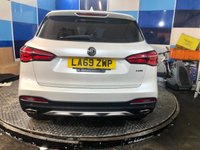 USED 2020 69 MG MG HS 1.5 T-GDI Exclusive SUV 5dr Petrol DCT Euro 6 (s/s) (162 ps) A  truly stunning example of this very highly sought after very low mileage Ulez compliant automatic Suv finished in Pearl White complimented with 18" alloys .This vehicle comes fully serviced with full mot ,and comes equipped with panoramic glass roof with sunroof ,power tailgate ,full black leather heated and electric seats ,rear parking sensors with reverse camera ,auto lights and wipers .power folding mirrors  ,Blue tooth connectivity ,Dab stereo with usb inputs .onboard computer adaptive cr