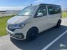 USED 2022 72 VOLKSWAGEN CALIFORNIA 2.0 BiTDI Ocean Camper 4dr Diesel DSG Euro 6 (s/s) (204 ps) AUTOMATIC DSG - Absolutely stunning 4 berth ready for your family adventures! Super modern styling combined with practicality and loaded with storage space, this camper has it all. Electric pop-top, reversing camera, heated seats, sat nav, parking sensors, digital control panel, infotainment system with bluetooth, adjustable suspension, wind out awning and outdoor shower point. On the habitation side the pop top sleeps two with a memory foam mattress, rock and roll bed underneath which easily converts to a double bed. Tonnes of cupboard storage space - even a vanity cupboard above the sink! Kitchen is fully equipped with glass worktops, gas hob, sink and icebox. sliding doors provide under counter access to storage with soft close cutlery drawer. Inside the back door there is a bench seat perfect for relaxing and taking in the views, stow away chairs, more storage space and an outdoor shower point. This camper must be seen to be appreciated! Yours for �&pound;63,995. Up to 7 years finance and warranty packages available, DIMENSIONS: LENGTH - 4.9M, WIDTH - 1.9M, HEIGHT (ROOF CLOSED) - 1.99M 