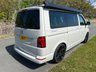 USED 2022 72 VOLKSWAGEN CALIFORNIA 2.0 BiTDI Ocean Camper 4dr Diesel DSG Euro 6 (s/s) (204 ps) AUTOMATIC DSG - Absolutely stunning 4 berth ready for your family adventures! Super modern styling combined with practicality and loaded with storage space, this camper has it all. Electric pop-top, reversing camera, heated seats, sat nav, parking sensors, digital control panel, infotainment system with bluetooth, adjustable suspension, wind out awning and outdoor shower point. On the habitation side the pop top sleeps two with a memory foam mattress, rock and roll bed underneath which easily converts to a double bed. Tonnes of cupboard storage space - even a vanity cupboard above the sink! Kitchen is fully equipped with glass worktops, gas hob, sink and icebox. sliding doors provide under counter access to storage with soft close cutlery drawer. Inside the back door there is a bench seat perfect for relaxing and taking in the views, stow away chairs, more storage space and an outdoor shower point. This camper must be seen to be appreciated! Yours for �&pound;63,995. Up to 7 years finance and warranty packages available, DIMENSIONS: LENGTH - 4.9M, WIDTH - 1.9M, HEIGHT (ROOF CLOSED) - 1.99M 