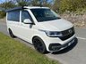 USED 2022 72 VOLKSWAGEN CALIFORNIA 2.0 BiTDI Ocean Camper 4dr Diesel DSG Euro 6 (s/s) (204 ps) AUTOMATIC DSG - Absolutely stunning 4 berth ready for your family adventures! Super modern styling combined with practicality and loaded with storage space, this camper has it all. Electric pop-top, reversing camera, heated seats, sat nav, parking sensors, digital control panel, infotainment system with bluetooth, adjustable suspension, wind out awning and outdoor shower point. On the habitation side the pop top sleeps two with a memory foam mattress, rock and roll bed underneath which easily converts to a double bed. Tonnes of cupboard storage space - even a vanity cupboard above the sink! Kitchen is fully equipped with glass worktops, gas hob, sink and icebox. sliding doors provide under counter access to storage with soft close cutlery drawer. Inside the back door there is a bench seat perfect for relaxing and taking in the views, stow away chairs, more storage space and an outdoor shower point. This camper must be seen to be appreciated! Yours for �&pound;63,995. Up to 7 years finance and warranty packages available, DIMENSIONS: LENGTH - 4.9M, WIDTH - 1.9M, HEIGHT (ROOF CLOSED) - 1.99M 
