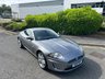 USED 2011 11 JAGUAR XK 5.0 V8 Portfolio Coupe 2dr Petrol Auto Euro 5 (385 ps)-Superb Example-Finished In Lunar Grey Metallic With Heated Ebony Leather Upholstery.11 Services On File-Great Value & Ready For The Summer. 