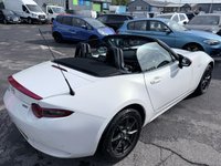 USED 2016 66 MAZDA MX-5 White 1.5 SKYACTIV-G convertible, 54,000 miles, Euro 6, Sat nav, Leather, Electric roof, 6-Speed manual, 16in Alloys, 7in Touchscreen ULEZ compliant. This stunning 2016 Mazda MX-5 1.5 SKYACTIV-G Icon Convertible is a fantastic example of one of the most iconic and enjoyable sports cars on the road today. Having had just two owners from new, this MX-5 has been well cared for throughout its life and offers the perfect combination of style, reliability, performance, and economy. Powered by Mazda's renowned 1.5 litre SKYACTIV-G petrol engine and paired with a smooth manual gearbox, it delivers an engaging driving experience with precise handling,