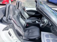 USED 2016 66 MAZDA MX-5 White 1.5 SKYACTIV-G convertible, 54,000 miles, Euro 6, Sat nav, Leather, Electric roof, 6-Speed manual, 16in Alloys, 7in Touchscreen ULEZ compliant. This stunning 2016 Mazda MX-5 1.5 SKYACTIV-G Icon Convertible is a fantastic example of one of the most iconic and enjoyable sports cars on the road today. Having had just two owners from new, this MX-5 has been well cared for throughout its life and offers the perfect combination of style, reliability, performance, and economy. Powered by Mazda's renowned 1.5 litre SKYACTIV-G petrol engine and paired with a smooth manual gearbox, it delivers an engaging driving experience with precise handling,