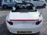 USED 2016 66 MAZDA MX-5 White 1.5 SKYACTIV-G convertible, 54,000 miles, Euro 6, Sat nav, Leather, Electric roof, 6-Speed manual, 16in Alloys, 7in Touchscreen ULEZ compliant. This stunning 2016 Mazda MX-5 1.5 SKYACTIV-G Icon Convertible is a fantastic example of one of the most iconic and enjoyable sports cars on the road today. Having had just two owners from new, this MX-5 has been well cared for throughout its life and offers the perfect combination of style, reliability, performance, and economy. Powered by Mazda's renowned 1.5 litre SKYACTIV-G petrol engine and paired with a smooth manual gearbox, it delivers an engaging driving experience with precise handling,