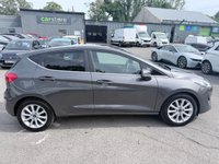 USED 2017 67 FORD FIESTA Grey 1.0T EcoBoost Titanium hatchback, 52,000 miles, Euro 6, ULEZ compliant, Sat Nav, CarPlay/Android Auto, Cruise, 16in alloys, A/C. This 2017 Ford Fiesta Titanium boasts exceptionally low mileage for its age, having covered just 52,000 miles. This popular hatchback is powered by an efficient 1.0 litre petrol engine, meeting Euro 6 emissions standards. The Titanium trim level ensures a well equipped driving experience, featuring the NCAP Pack for enhanced safety, including automatic headlights. Comfort is further assured with Electronic Automatic Temperature Control air conditioning, providing precise climate control. For sea