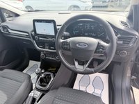 USED 2017 67 FORD FIESTA Grey 1.0T EcoBoost Titanium hatchback, 52,000 miles, Euro 6, ULEZ compliant, Sat Nav, CarPlay/Android Auto, Cruise, 16in alloys, A/C. This 2017 Ford Fiesta Titanium boasts exceptionally low mileage for its age, having covered just 52,000 miles. This popular hatchback is powered by an efficient 1.0 litre petrol engine, meeting Euro 6 emissions standards. The Titanium trim level ensures a well equipped driving experience, featuring the NCAP Pack for enhanced safety, including automatic headlights. Comfort is further assured with Electronic Automatic Temperature Control air conditioning, providing precise climate control. For sea
