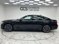 USED 2022 22 BMW 7 SERIES 3.0 730d MHT M Sport Saloon 4dr Diesel Hybrid Auto Euro 6 (s/s) (286 ps) Finished In Black Sapphire, This 7 Series Comes With The M Sport Pro Package, Full BMW Service History, 20" M Light Star Spoke Alloy Wheels, Sun Protection Glazing, Front And Rear Memory Seats, Harman Kardon Premium Sound System, Front And Rear Heated Seats, 360 Degree Surround Camera, Park Assist, Power Operated Tailgate, 2 Keys, 12 Months MOT, 3 Months Warranty. Finance And Extended Warranty Available.