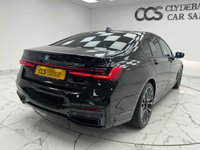 USED 2022 22 BMW 7 SERIES 3.0 730d MHT M Sport Saloon 4dr Diesel Hybrid Auto Euro 6 (s/s) (286 ps) Finished In Black Sapphire, This 7 Series Comes With The M Sport Pro Package, Full BMW Service History, 20" M Light Star Spoke Alloy Wheels, Sun Protection Glazing, Front And Rear Memory Seats, Harman Kardon Premium Sound System, Front And Rear Heated Seats, 360 Degree Surround Camera, Park Assist, Power Operated Tailgate, 2 Keys, 12 Months MOT, 3 Months Warranty. Finance And Extended Warranty Available.