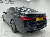 USED 2022 22 BMW 7 SERIES 3.0 730d MHT M Sport Saloon 4dr Diesel Hybrid Auto Euro 6 (s/s) (286 ps) Finished In Black Sapphire, This 7 Series Comes With The M Sport Pro Package, Full BMW Service History, 20" M Light Star Spoke Alloy Wheels, Sun Protection Glazing, Front And Rear Memory Seats, Harman Kardon Premium Sound System, Front And Rear Heated Seats, 360 Degree Surround Camera, Park Assist, Power Operated Tailgate, 2 Keys, 12 Months MOT, 3 Months Warranty. Finance And Extended Warranty Available.
