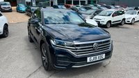 USED 2019 19 VOLKSWAGEN TOUAREG 3.0 TDI V6 R-Line Tech SUV 5dr Diesel Tiptronic 4Motion Euro 6 (s/s) (286 ps)in metallic blue/black with only 1 owner and a full main dealer service history along with a great spec... This 2019 Volkswagen Touareg TDI V6 R Line Tech is a superb example, having been owned by just one careful keeper. With a full Volkswagen service history with a full service record printout. This premium SUV boasts a powerful 3.0 litre diesel engine, paired with a smooth automatic transmission and Volkswagen's renowned four wheel drive system, ensuring confident performance in all conditions. As a Euro 6 compliant vehicle, it meets stringent emission standards. The R Line Tech trim level signifi