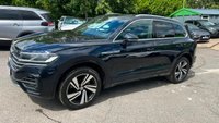 USED 2019 19 VOLKSWAGEN TOUAREG 3.0 TDI V6 R-Line Tech SUV 5dr Diesel Tiptronic 4Motion Euro 6 (s/s) (286 ps)in metallic blue/black with only 1 owner and a full main dealer service history along with a great spec... This 2019 Volkswagen Touareg TDI V6 R Line Tech is a superb example, having been owned by just one careful keeper. With a full Volkswagen service history with a full service record printout. This premium SUV boasts a powerful 3.0 litre diesel engine, paired with a smooth automatic transmission and Volkswagen's renowned four wheel drive system, ensuring confident performance in all conditions. As a Euro 6 compliant vehicle, it meets stringent emission standards. The R Line Tech trim level signifi