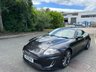 USED 2011 11 JAGUAR XKR 5.0 V8 Coupe 2dr Petrol Auto Euro 5 (510 ps)-Fantastic Example, Finished In Stratus Grey Metallic With Heated Ivory Leather Upholstery.3 Former Keepers-Last Keeper Since June 2016-Fitted With a Speed Pack.The 2011 Jaguar XKR Speed Pack is an optional performance and styling upgrade package for the supercharged Jaguar XKR Coupe. It unlocked a higher top speed and added a factory aerodynamic body kit to improve high-speed stability. 