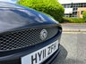 USED 2011 11 JAGUAR XKR 5.0 V8 Coupe 2dr Petrol Auto Euro 5 (510 ps)-Fantastic Example, Finished In Stratus Grey Metallic With Heated Ivory Leather Upholstery.3 Former Keepers-Last Keeper Since June 2016-Fitted With a Speed Pack.The 2011 Jaguar XKR Speed Pack is an optional performance and styling upgrade package for the supercharged Jaguar XKR Coupe. It unlocked a higher top speed and added a factory aerodynamic body kit to improve high-speed stability. 