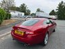 USED 2014 14 JAGUAR XK 5.0 V8 Signature Coupe 2dr Petrol Auto Euro 5 (385 ps)-Great Example, Finished In Italian Racing Red Metallic-Heated Ivory Leather Upholstery-2 Owner Car From New-Last Keeper Since August 2022-The 2014 Jaguar XK Signature Edition is a highly exclusive, final-run special edition that Jaguar released to commemorate the final year of the X150-generation XK grand tourer. Built as a luxury-focused farewell model, only 400 examples were allocated for the UK market, making it a highly desirable modern classic for collectors and grand touring enthusiasts alike. 