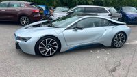 USED 2015 E BMW I8 Silver 1.5 7.1kWh Plug-in hybrid coupe, 49,050 miles, ULEZ compliant, Automatic 4WD, 20in alloys, HK audio, Sat nav, Camera, Cruise, 8.8in Display. This 2015 BMW i8 presents a remarkable opportunity with exceptionally low mileage for its age, having covered just 49,050 miles. This impressive plug in hybrid sports car features a 1.5 litre petrol engine and four wheel drive, meeting Euro 6 emission standards. It comes with a 3 month warranty for your peace of mind, and its MOT is valid until March 2027. Notable features include striking 20 inch BMW i Turbine Spoke Style 625 alloy wheels, a comprehensive Driving Assistant system, and eye catch