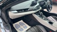 USED 2015 E BMW I8 Silver 1.5 7.1kWh Plug-in hybrid coupe, 49,050 miles, ULEZ compliant, Automatic 4WD, 20in alloys, HK audio, Sat nav, Camera, Cruise, 8.8in Display. This 2015 BMW i8 presents a remarkable opportunity with exceptionally low mileage for its age, having covered just 49,050 miles. This impressive plug in hybrid sports car features a 1.5 litre petrol engine and four wheel drive, meeting Euro 6 emission standards. It comes with a 3 month warranty for your peace of mind, and its MOT is valid until March 2027. Notable features include striking 20 inch BMW i Turbine Spoke Style 625 alloy wheels, a comprehensive Driving Assistant system, and eye catch