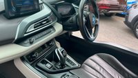 USED 2015 E BMW I8 Silver 1.5 7.1kWh Plug-in hybrid coupe, 49,050 miles, ULEZ compliant, Automatic 4WD, 20in alloys, HK audio, Sat nav, Camera, Cruise, 8.8in Display. This 2015 BMW i8 presents a remarkable opportunity with exceptionally low mileage for its age, having covered just 49,050 miles. This impressive plug in hybrid sports car features a 1.5 litre petrol engine and four wheel drive, meeting Euro 6 emission standards. It comes with a 3 month warranty for your peace of mind, and its MOT is valid until March 2027. Notable features include striking 20 inch BMW i Turbine Spoke Style 625 alloy wheels, a comprehensive Driving Assistant system, and eye catch