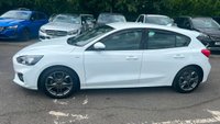 USED 2020 70 FORD FOCUS 1.5 EcoBlue ST-Line Hatchback 5dr Diesel Manual Euro 6 (s/s) (120 ps) in white with only 2 owners and a full service history in lovely condition. This 2020 Ford Focus ST Line offers a compelling blend of sporty styling and efficient diesel performance.  Powered by a 1.5 litre Euro 6 compliant diesel engine with a full service history with 5 service stamps, this ST Line variant is designed for those who appreciate a dynamic driving experience without compromising on economy.  Its registration year of 2020 places it within a modern generation of the Focus, known for its refined handling and comfortable interior.  The ST Line trim level sign