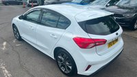 USED 2020 70 FORD FOCUS 1.5 EcoBlue ST-Line Hatchback 5dr Diesel Manual Euro 6 (s/s) (120 ps) in white with only 2 owners and a full service history in lovely condition. This 2020 Ford Focus ST Line offers a compelling blend of sporty styling and efficient diesel performance.  Powered by a 1.5 litre Euro 6 compliant diesel engine with a full service history with 5 service stamps, this ST Line variant is designed for those who appreciate a dynamic driving experience without compromising on economy.  Its registration year of 2020 places it within a modern generation of the Focus, known for its refined handling and comfortable interior.  The ST Line trim level sign